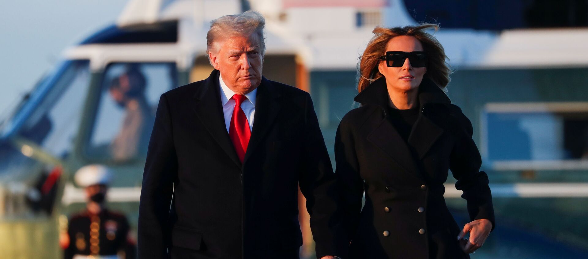 U.S. President Donald Trump and first lady Melania Trump prepare to board Air Force One at Joint Base Andrews in Maryland, U.S., December 23, 2020. - Sputnik International, 1920, 25.12.2020