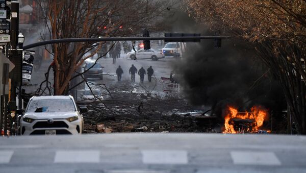 A vehicle burns near the site of an explosion in the area of Second and Commerce in Nashville, Tennessee, U.S. December 25, 2020. Andrew Nelles/Tennessean.com/USA TODAY NETWORK via REUTERS.  - Sputnik International