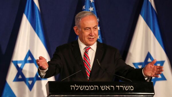Israeli Prime Minister Benjamin Netanyahu speaks during a news conference with White House senior adviser Jared Kushner (not pictured), in Jerusalem December 21, 2020. - Sputnik International