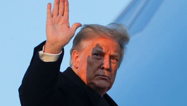 U.S. President Donald Trump waves as he boards Air Force One at Joint Base Andrews in Maryland, U.S., December 23, 2020. - Sputnik International
