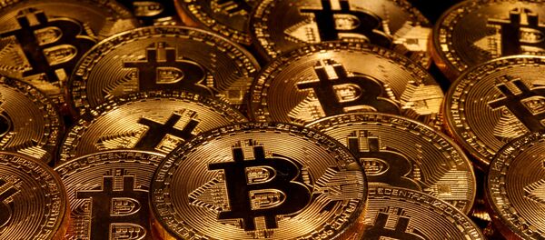 Representations of virtual currency Bitcoin are seen in this illustration taken taken 13 March 2020. - Sputnik International