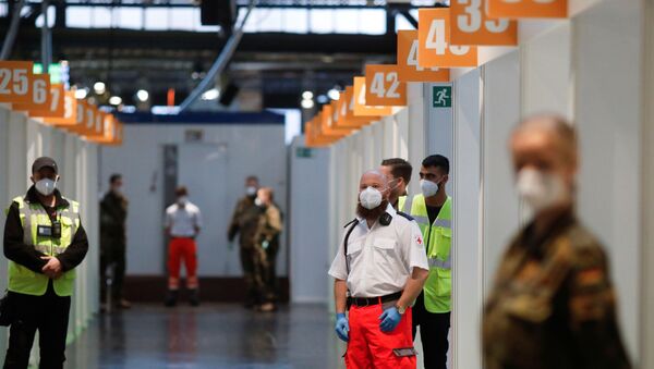 Staff wait for start of vaccination against the coronavirus disease (COVID-19) at the Treptow Arena vaccination center in Berlin, Germany December 27, 2020. - Sputnik International