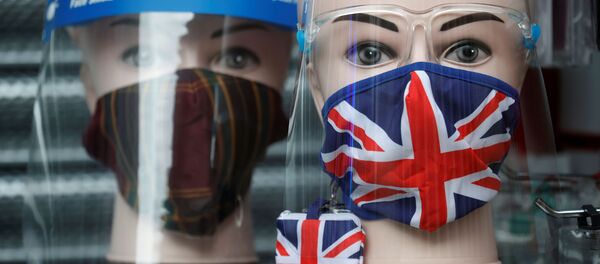 A Union Jack design face mask is seen for sale in the window of a shop amid the outbreak of the coronavirus disease (COVID-19) in Manchester, Britain, December 26, 2020 - Sputnik International