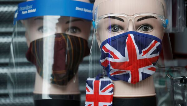 A Union Jack design face mask is seen for sale in the window of a shop amid the outbreak of the coronavirus disease (COVID-19) in Manchester, Britain, December 26, 2020 - Sputnik International