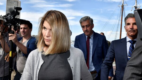 FILE PHOTO: Actress Lori Loughlin, and her husband, fashion designer Mossimo Giannulli leave the federal courthouse after a hearing on charges in a nationwide college admissions cheating scheme in Boston, Massachusetts, U.S., August 27, 2019.  REUTERS/Josh Reynolds/File Photo - Sputnik International