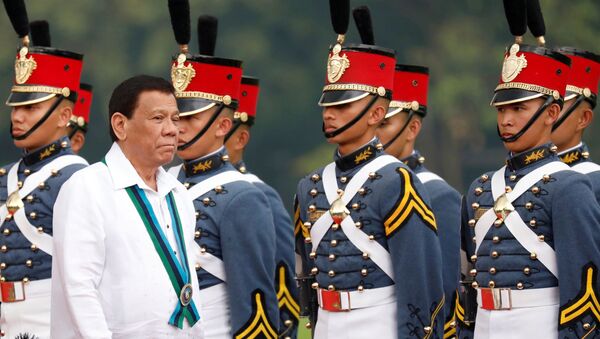 Philippines President Rodrigo Duterte reviews military cadets during change of command ceremonies of the Armed Forces of the Philippines (AFP) at Camp Aguinaldo in Quezon City, metro Manila, Philippines 26 October 2017. - Sputnik International