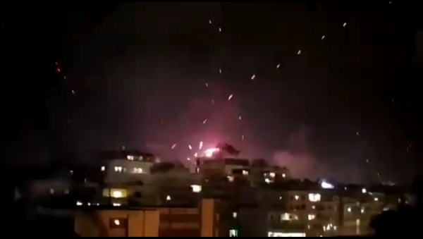 Fireworks and tracer rounds mix in the skies about Beirut, Lebanon, as revelers ring in the year 2021 just after midnight - Sputnik International