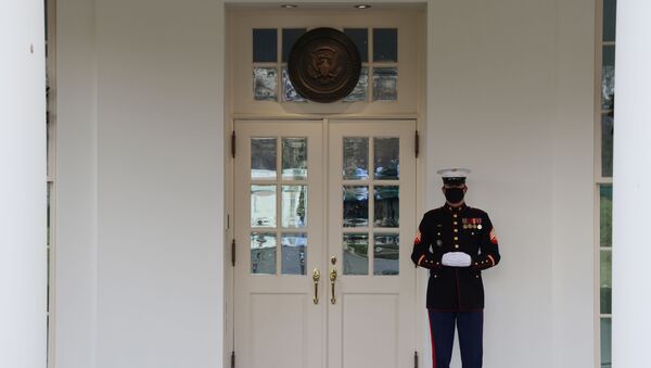 A general view of the door to the West Wing, where the presence of a U.S. Marine is an indication that U.S. President Donald Trump is present in the Oval Office, one of a combination of photos made once an hour during the president's ostensible workday — from the White House press office's morning call time until the calling of the daily press lid — at the White House in Washington, U.S. December 22, 2020 - Sputnik International