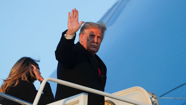 U.S. President Donald Trump waves as he boards Air Force One beside first lady Melania Trump at Joint Base Andrews in Maryland, U.S., December 23, 2020 - Sputnik International