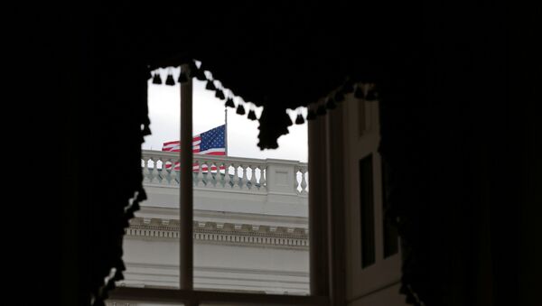 An American flag waves outside a window at the U.S. Capitol shortly before the Senate adjourns for the year, on Capitol Hill in Washington, U.S., December 31, 2020 - Sputnik International
