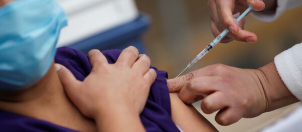 A medical worker receives an injection with a dose of the Pfizer-BioNTech COVID-19 vaccine at the Regional Military Specialty Hospital in San Nicolas de los Garza, on the outskirts of Monterrey, Mexico 29 December, 2020 A medical worker receives an injection with a dose of the Pfizer-BioNTech COVID-19 vaccine at the Regional Military Specialty Hospital in San Nicolas de los Garza, on the outskirts of Monterrey, Mexico 29 December, 2020 - Sputnik International