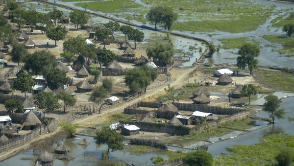 Thatched huts surrounded by floodwaters are seen from the air in Old Fangak county, Jonglei state, South Sudan Friday, Nov. 27, 2020. Some 1 million people in the country have been displaced or isolated for months by the worst flooding in memory, with the intense rainy season a sign of climate change.  - Sputnik International