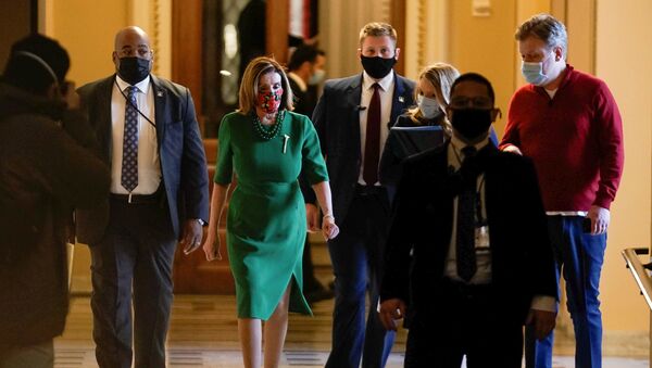Speaker of the House Nancy Pelosi (D-CA) walks back to her office after opening the House floor following an agreement of a coronavirus disease (COVID-19) aid package the night before on Capitol Hill, Washington, D.C., U.S., December 21, 2020.  - Sputnik International