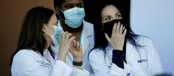 Health workers chat during a press conference before some workers of the staff receive the Pfizer-BioNTech COVID-19 Vaccine at Memorial Healthcare System facility in Miramar, Florida, U.S., December 14, 2020. Health workers chat during a press conference before some workers of the staff receive the Pfizer-BioNTech COVID-19 Vaccine at Memorial Healthcare System facility in Miramar, Florida, U.S., December 14, 2020. - Sputnik International