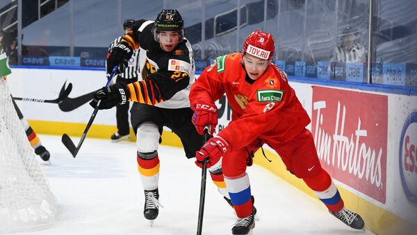 Russia's Arseni Gritsyuk #8 stickhandles the puck against Germany's Jan Munzenberger #27 in quarterfinal round action at the 2021 IIHF World Junior Championship at Rogers Place on January 2, 2021 in Edmonton, AB Canada. - Sputnik International
