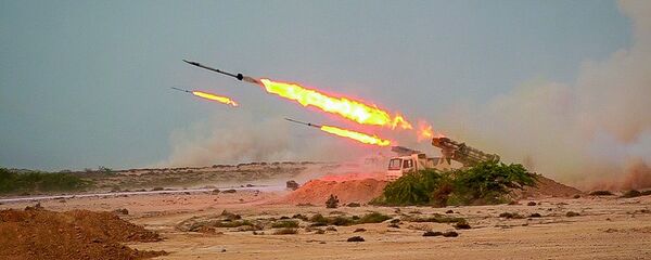 In this photo released Tuesday, July 28, 2020, by Sepahnews, missiles are fired in a Revolutionary Guard military exercise. Iran's paramilitary Revolutionary Guard fired a missile from a helicopter targeting the mock-up aircraft carrier in the strategic Strait of Hormuz. That's according to footage aired on state television on Tuesday. Iranian commandos also fast-roped down from a helicopter onto the replica in the footage from the exercise called Great Prophet 14. The drill appears aimed at threatening the U.S. amid tensions between Tehran and Washington. - Sputnik International
