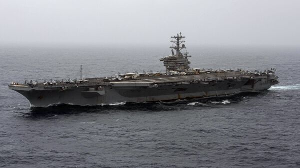 In this Sept. 7, 2020, file photo released by the U.S. Navy, the aircraft carrier USS Nimitz transits the Arabian Sea. The Pentagon announced Thursday, Dec. 31, 2020, that the USS Nimitz, the only Navy aircraft carrier operating in the Middle East, will return home to the U.S. West Coast. - Sputnik International
