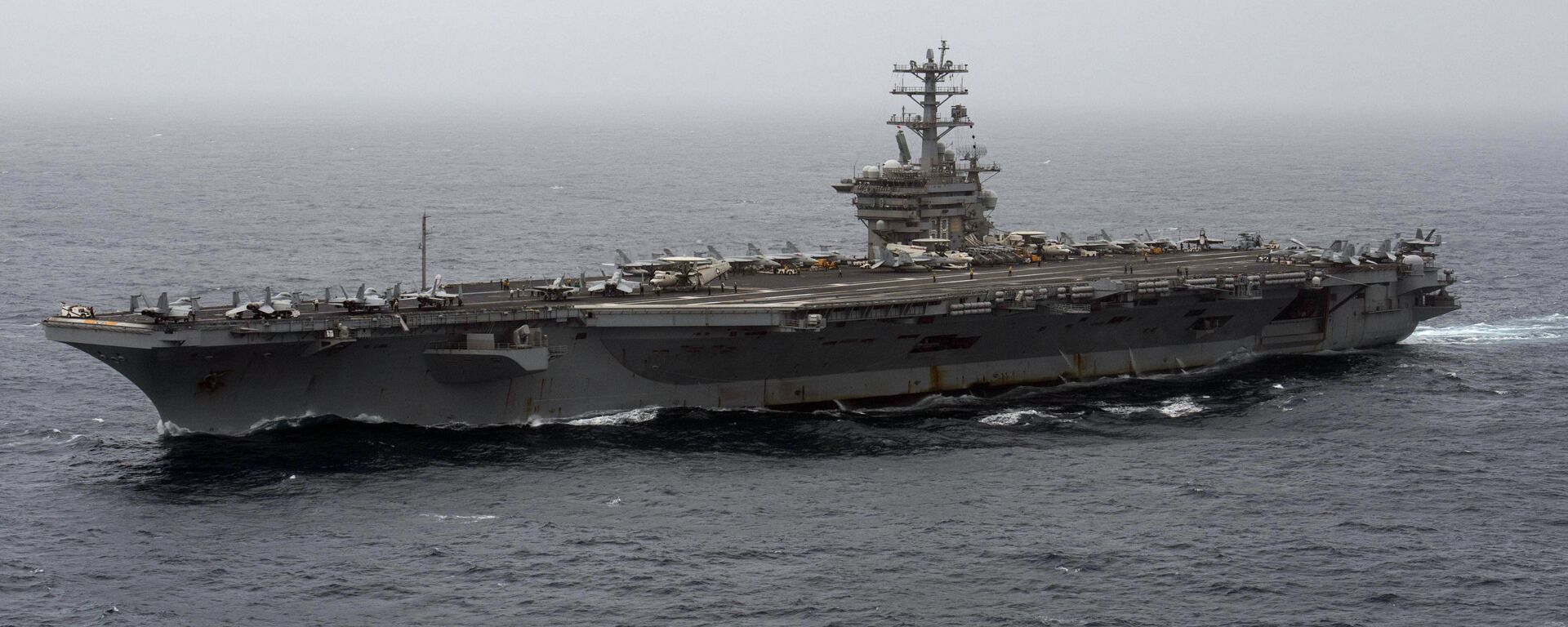 In this Sept. 7, 2020, file photo released by the U.S. Navy, the aircraft carrier USS Nimitz transits the Arabian Sea. The Pentagon announced Thursday, Dec. 31, 2020, that the USS Nimitz, the only Navy aircraft carrier operating in the Middle East, will return home to the U.S. West Coast. - Sputnik International, 1920, 17.05.2023