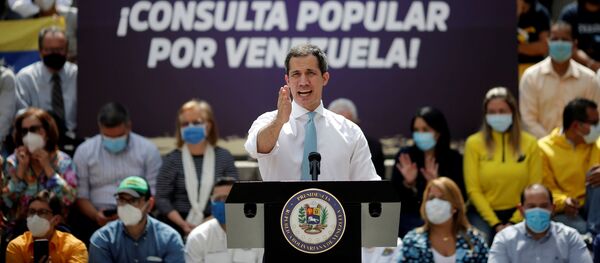 Opposition leader Juan Guaido speaks to the media during a news conference, the day before a popular consultation meant to reject December 6 parliamentary election in Caracas, Venezuela December 11, 2020. REUTERS/Manaure Quintero - Sputnik International