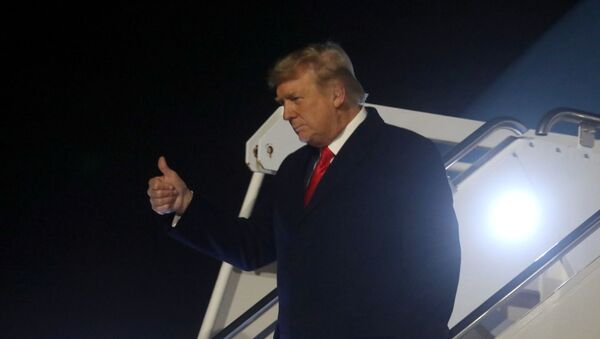 U.S. President Donald Trump leaves Air Force One upon arrival at Dobbins Air Reserve Base, Marietta, Georgia, as he makes his way to a campaign rally in Dalton, Georgia, U.S., on the eve of the run-off election to decide both of Georgia's Senate seats January 4, 2021. - Sputnik International