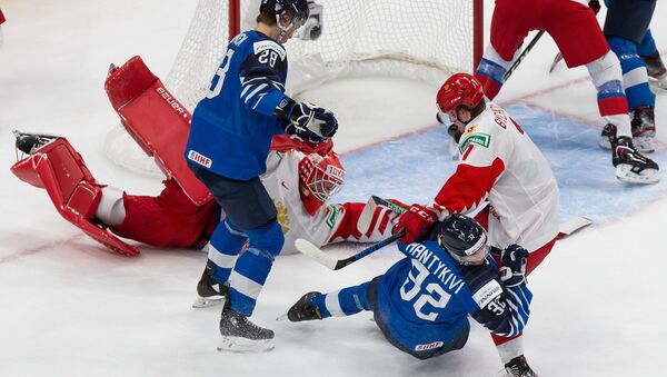 Roman Bychkov #7 of Russia shoves Matias Mantykivi #32 of Finland to the ice during the 2021 IIHF World Junior Championship bronze medal game at Rogers Place on January 5, 2021 in Edmonton, Canada. - Sputnik International
