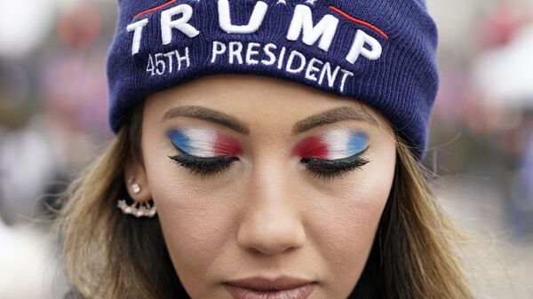 A person attends a rally at Freedom Plaza Tuesday, Jan. 5, 2021, in Washington, in support of President Donald Trump.  - Sputnik International