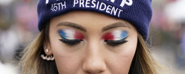 A person attends a rally at Freedom Plaza Tuesday, Jan. 5, 2021, in Washington, in support of President Donald Trump. A person attends a rally at Freedom Plaza Tuesday, Jan. 5, 2021, in Washington, in support of President Donald Trump. - Sputnik International
