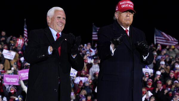 President Donald Trump and Vice President Mike Pence smile after a campaign rally at Gerald R. Ford International Airport, early Tuesday, Nov. 3, 2020, in Grand Rapids, Mich - Sputnik International