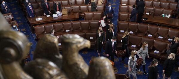 Senate pages carry boxes containing Electoral College votes into a joint session of the House and Senate convenes to count the electoral votes cast in November's election, at the Capitol, Wednesday, Jan 6, 2021. (AP Photo/Andrew Harnik) Senate pages carry boxes containing Electoral College votes into a joint session of the House and Senate convenes to count the electoral votes cast in November's election, at the Capitol, Wednesday, Jan 6, 2021. (AP Photo/Andrew Harnik) - Sputnik International
