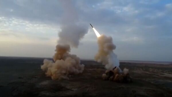 This video grab shows launching underground ballistic missiles by the Iranian Revolutionary Guard during a military exercise. - Sputnik International