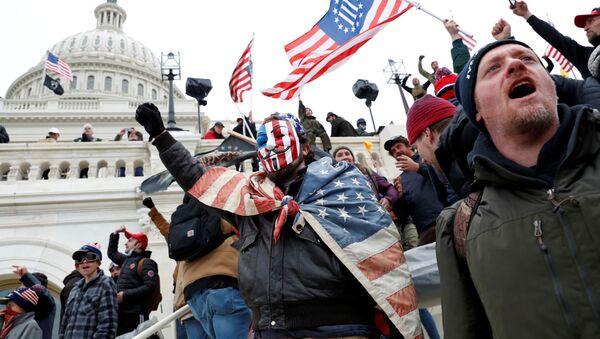 Protesters clash with Capitol police during a rally to contest the certification of the 2020 U.S. presidential election results by the U.S. Congress, at the U.S. Capitol Building in Washington, U.S, January 6, 2021. - Sputnik International
