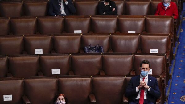 Sen. Josh Hawley, R-Mo., listens as a joint session of the House and Senate reconvenes to confirm the Electoral College votes at the Capitol, Wednesday, Jan 6, 2021 - Sputnik International