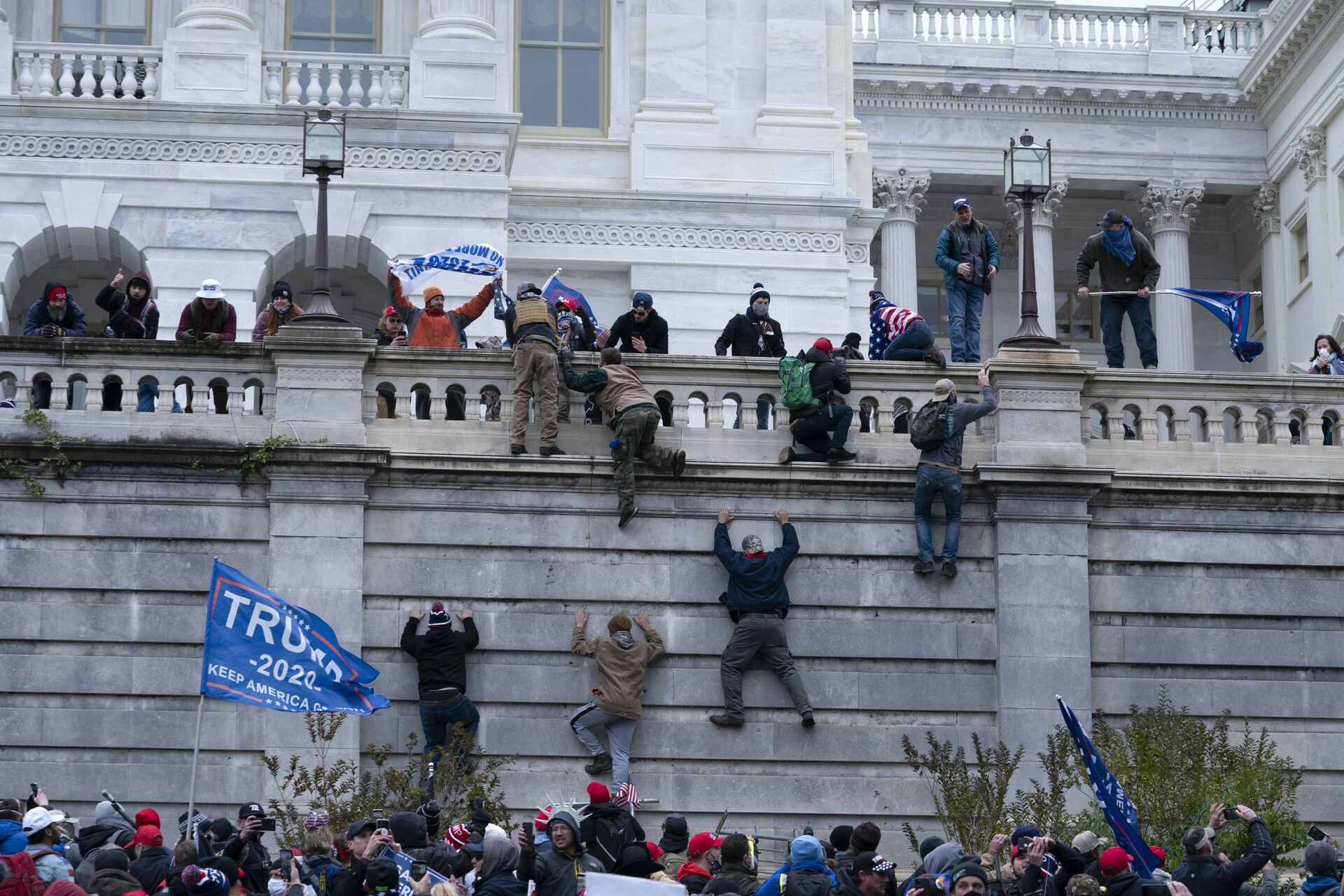 Supporters of President Donald Trump climb the west wall of the the US Capitol on Wednesday, Jan. 6, 2021, in Washington - Sputnik International, 1920, 07.09.2021