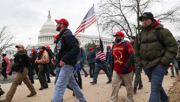 Members of the the far-right group Proud Boys march to the U.S. Capitol Building in Washington, U.S., January 6, 2021. - Sputnik International