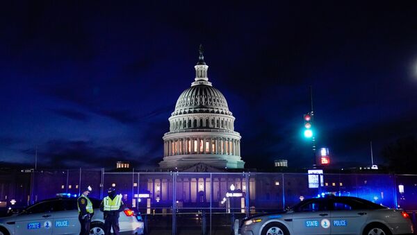The U.S. Capitol is seen behind heavy-duty security fencing the day after supporters of U.S. President Donald Trump stormed the Capitol in Washington, U.S., January 7, 2021. - Sputnik International