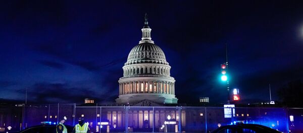 The U.S. Capitol is seen behind heavy-duty security fencing the day after supporters of U.S. President Donald Trump stormed the Capitol in Washington, U.S., January 7, 2021. - Sputnik International