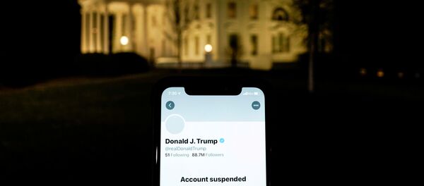 A photo illustration shows the suspended Twitter account of U.S. President Donald Trump on a smartphone and the White House in Washington, U.S., January 8, 2021. A photo illustration shows the suspended Twitter account of U.S. President Donald Trump on a smartphone and the White House in Washington, U.S., January 8, 2021. - Sputnik International