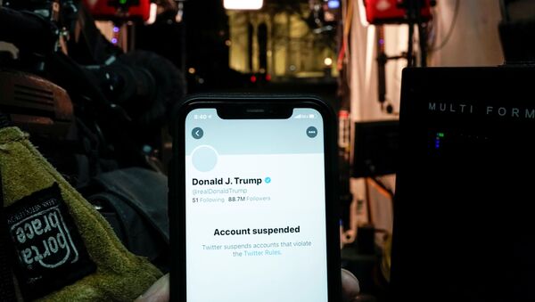 A photo illustration shows the suspended Twitter account of U.S. President Donald Trump on a smartphone in a media board cast tent at the White House in Washington, U.S., January 8, 2021. - Sputnik International