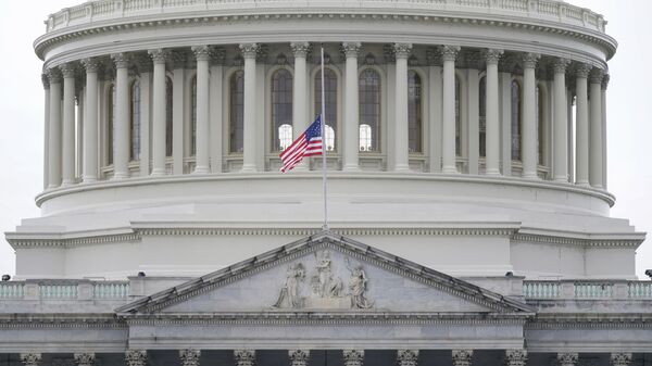 An American flag flies at half-staff in remembrance of U.S. Capitol Police Officer Brian Sicknick above the Capitol Building in Washington, Friday, Jan. 8, 2021 - Sputnik International