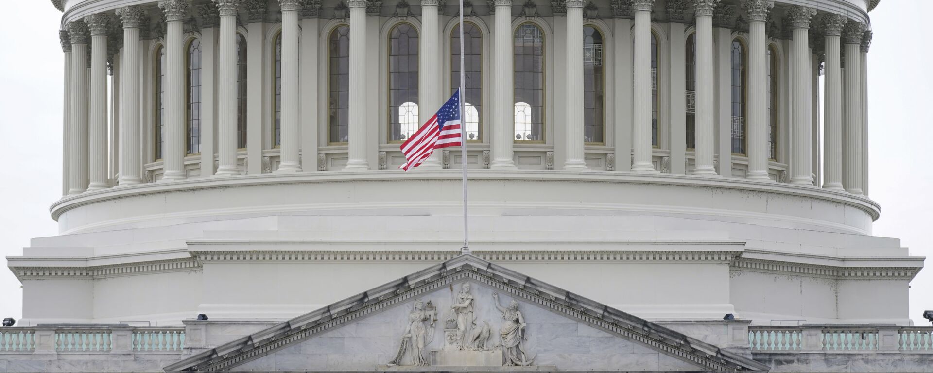An American flag flies at half-staff in remembrance of U.S. Capitol Police Officer Brian Sicknick above the Capitol Building in Washington, Friday, Jan. 8, 2021 - Sputnik International, 1920, 26.10.2023