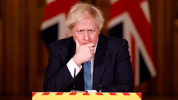 Britain's Prime Minister Boris Johnson reacts during a virtual news conference on the COVID-19 pandemic, at 10 Downing Street in London, Britain January 7, 2021 - Sputnik International