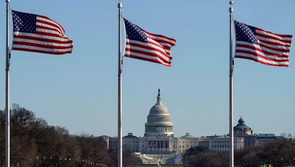 The U.S. Capitol is seen under flags flying on the National Mall days after supporters of U.S. President Donald Trump stormed the U.S. Capitol in Washington, U.S., January 10, 2021. - Sputnik International