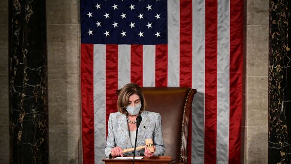 U.S. Speaker of the House Nancy Pelosi holds the Speaker's gavel as she leads the first session of the 117th House of Representatives and administers the oath of office to members in Washington, U.S., January 3, 2021. - Sputnik International
