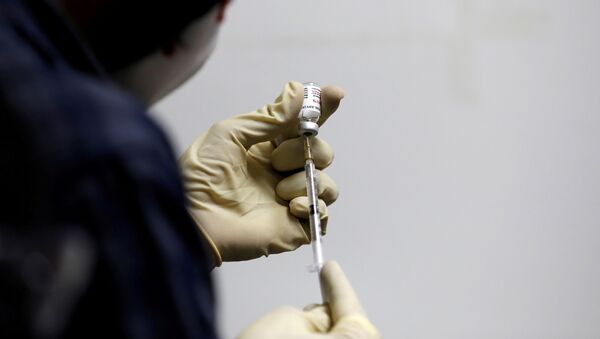 A medic fills a syringe with COVAXIN, an Indian government-backed experimental COVID-19 vaccine. - Sputnik International