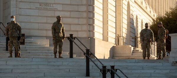National Guard troops stand watch at the Russell Senate Office Building across from the U.S. Capitol building on Capitol Hill in Washington, U.S., January 10, 2021. National Guard troops stand watch at the Russell Senate Office Building across from the U.S. Capitol building on Capitol Hill in Washington, U.S., January 10, 2021. - Sputnik International