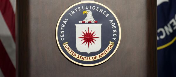 The lectern with CIA logo stands empty as reporters await the arrival of Director of Central Intelligence Agency John Brennan for a press conference at CIA headquarters in Langley, Virginia, December 11, 2014. The lectern with CIA logo stands empty as reporters await the arrival of Director of Central Intelligence Agency John Brennan for a press conference at CIA headquarters in Langley, Virginia, December 11, 2014. - Sputnik International