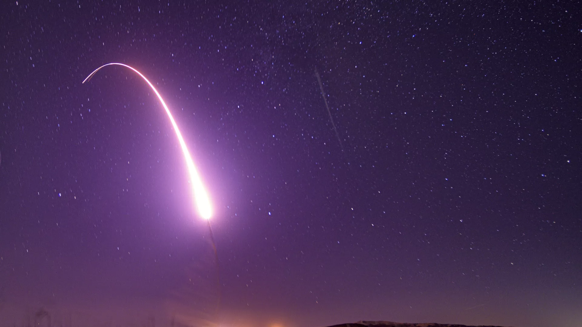 This image taken with a slow shutter speed on Oct. 2, 2019, and provided by the U.S. Air Force shows an unarmed Minuteman 3 intercontinental ballistic missile test launch at Vandenberg Air Force Base, Calif. The Pentagon has raised to $95.8 billion the estimated cost of fielding a new fleet of land-based nuclear missiles to replace the Minuteman 3 - Sputnik International, 1920, 01.12.2024