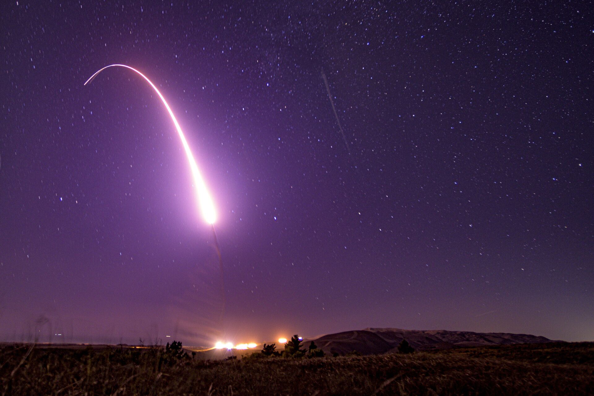 This image taken with a slow shutter speed on Oct. 2, 2019, and provided by the U.S. Air Force shows an unarmed Minuteman 3 intercontinental ballistic missile test launch at Vandenberg Air Force Base, Calif. The Pentagon has raised to $95.8 billion the estimated cost of fielding a new fleet of land-based nuclear missiles to replace the Minuteman 3 - Sputnik International, 1920, 13.12.2021