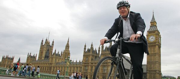 Boris Johnson cycles his bike over Westminster Bridge in central London on July 30, 2010. Boris Johnson cycles his bike over Westminster Bridge in central London on July 30, 2010. - Sputnik International