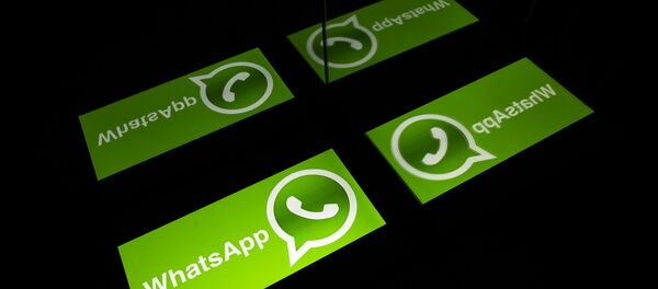 (FILES) This file photo taken on October 5, 2020 shows the logo of mobile messaging service WhatsApp on a tablet screen in Toulouse, southwestern France - Sputnik International
